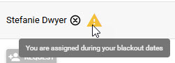 Assigned pro name with warning tooltip that they are assigned during blackout dates